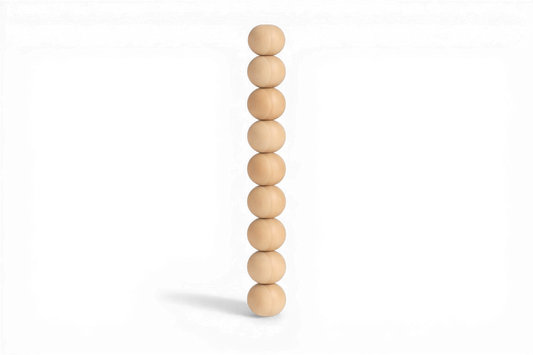 Stack of wooden beads on a white background